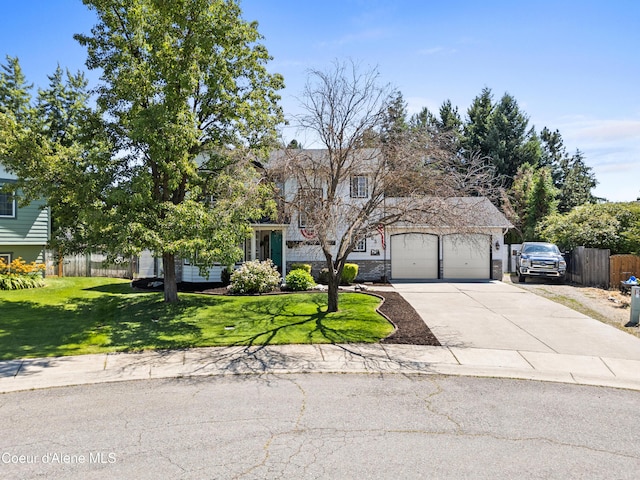 703 W Angus Ct, Post Falls, ID 83854 - obstructed view of property with driveway and a garage