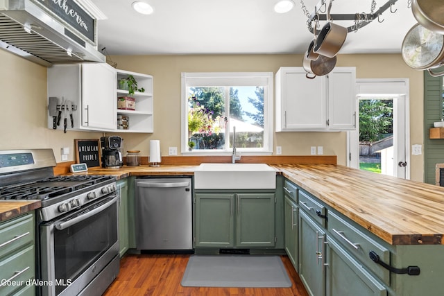 703 W Angus Ct, Post Falls, ID 83854 - kitchen featuring wood counters, appliances with stainless steel finishes, green cabinetry, and recessed lighting