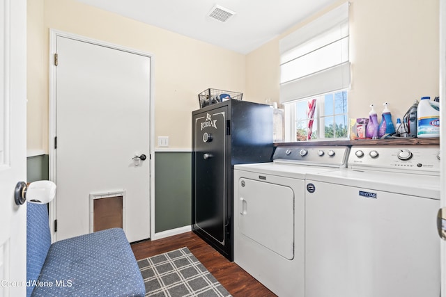 703 W Angus Ct, Post Falls, ID 83854 - laundry room with washing machine and dryer and dark wood-style floors