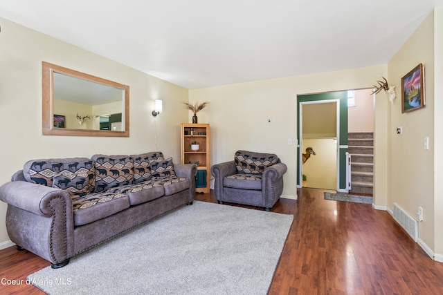 703 W Angus Ct, Post Falls, ID 83854 - living room with dark wood-style flooring and stairway