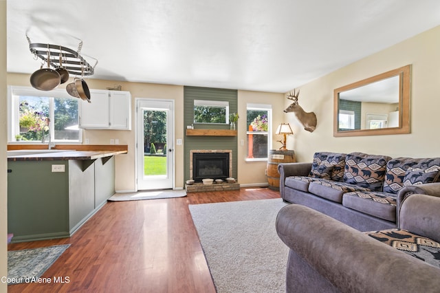 703 W Angus Ct, Post Falls, ID 83854 - living area featuring a fireplace and wood finished floors