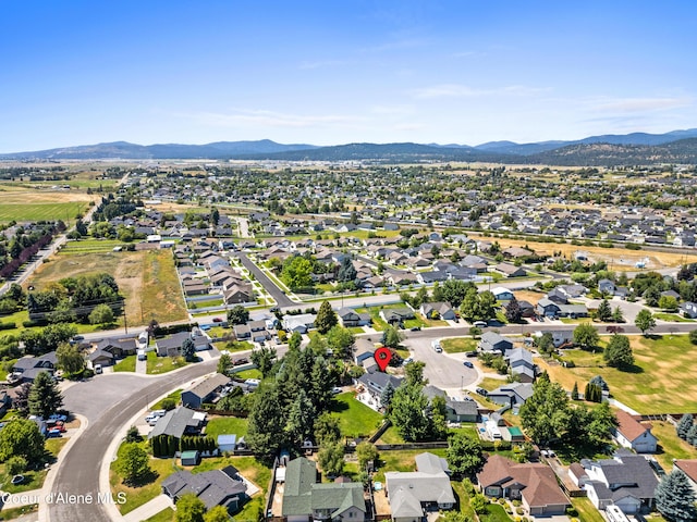 703 W Angus Ct, Post Falls, ID 83854 - aerial overview of property's location with a mountainous background and nearby suburban area