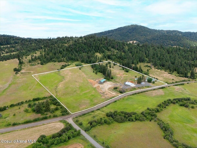 3297 Minaloosa Valley Rd, Plummer, ID 83851 - aerial view of sparsely populated area with property parcel outlined and a mountainous background