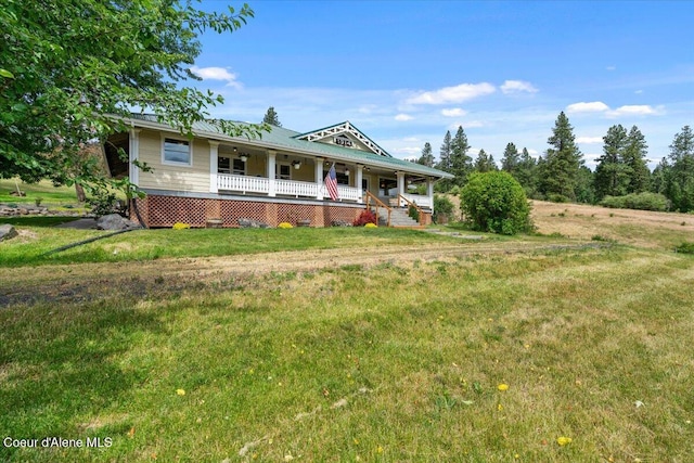 3297 Minaloosa Valley Rd, Plummer, ID 83851 - view of front of house featuring a porch and a front lawn