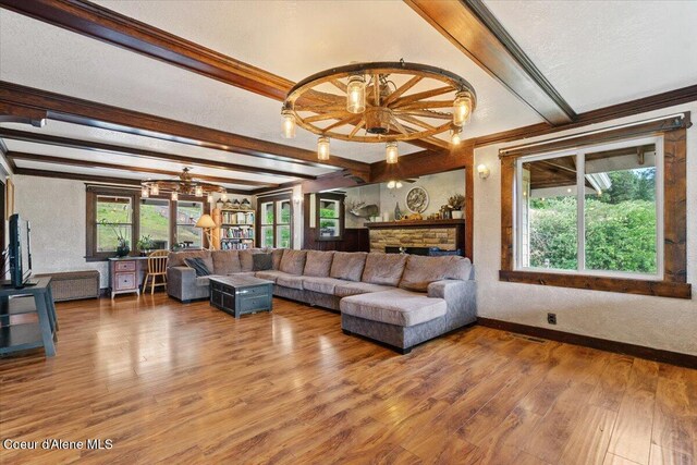 3297 Minaloosa Valley Rd, Plummer, ID 83851 - living area with a chandelier, ornamental molding, beam ceiling, and wood finished floors