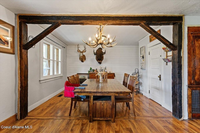 3297 Minaloosa Valley Rd, Plummer, ID 83851 - dining space with a chandelier and wood finished floors