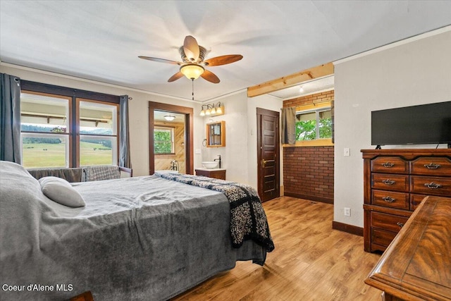 3297 Minaloosa Valley Rd, Plummer, ID 83851 - bedroom with light wood-style flooring, ornamental molding, ensuite bathroom, a ceiling fan, and access to outside