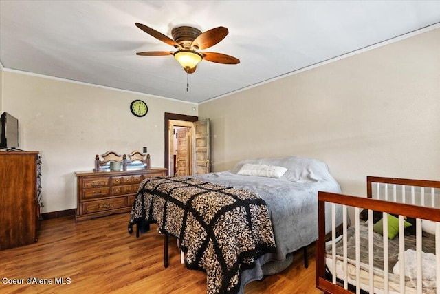 3297 Minaloosa Valley Rd, Plummer, ID 83851 - bedroom featuring crown molding, wood finished floors, and a ceiling fan