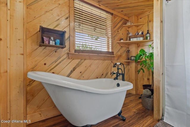 3297 Minaloosa Valley Rd, Plummer, ID 83851 - bathroom with wood walls, a freestanding bath, and wood finished floors