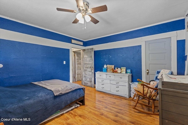3297 Minaloosa Valley Rd, Plummer, ID 83851 - bedroom with wood finished floors, ornamental molding, and ceiling fan