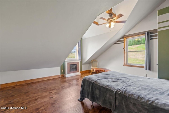 3297 Minaloosa Valley Rd, Plummer, ID 83851 - bedroom with vaulted ceiling, multiple windows, wood finished floors, and a ceiling fan