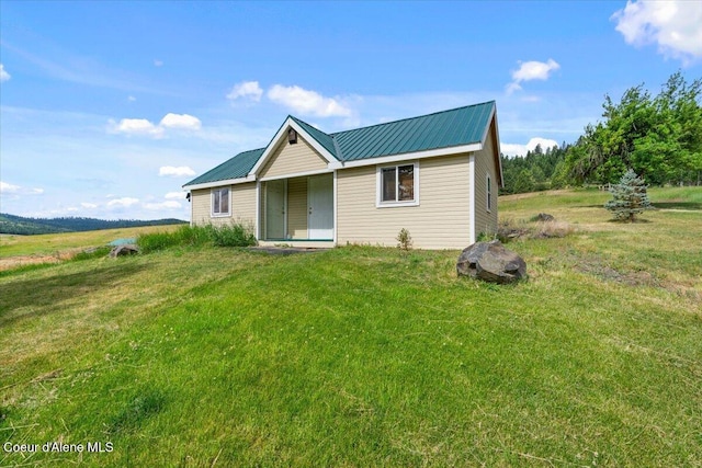 3297 Minaloosa Valley Rd, Plummer, ID 83851 - ranch-style home with a metal roof and a front yard