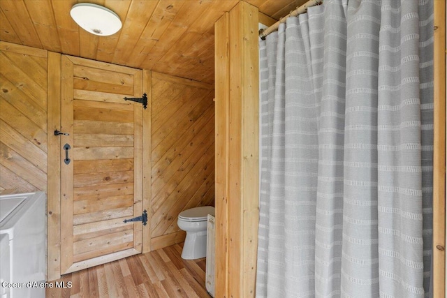 3297 Minaloosa Valley Rd, Plummer, ID 83851 - full bathroom featuring wood ceiling, wood finished floors, wooden walls, and curtained shower