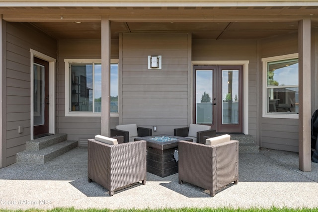 9433 N Justice Way, Hayden, ID 83835 - view of patio / terrace featuring french doors, entry steps, and an outdoor fire pit