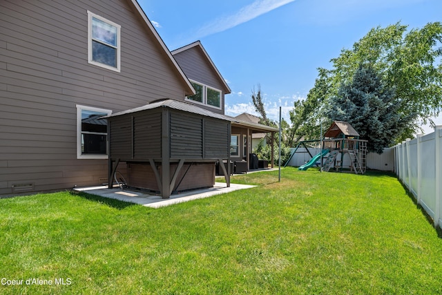 9433 N Justice Way, Hayden, ID 83835 - back of property with a fenced backyard and a playground