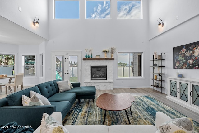 9433 N Justice Way, Hayden, ID 83835 - living area with a high ceiling, wood finished floors, and a fireplace