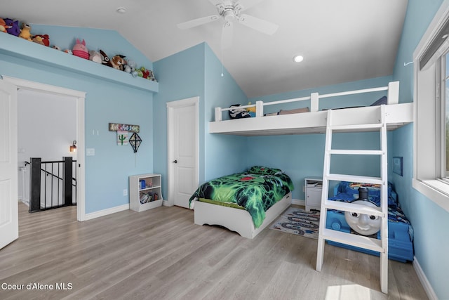 9433 N Justice Way, Hayden, ID 83835 - bedroom with wood finished floors, vaulted ceiling, and a ceiling fan