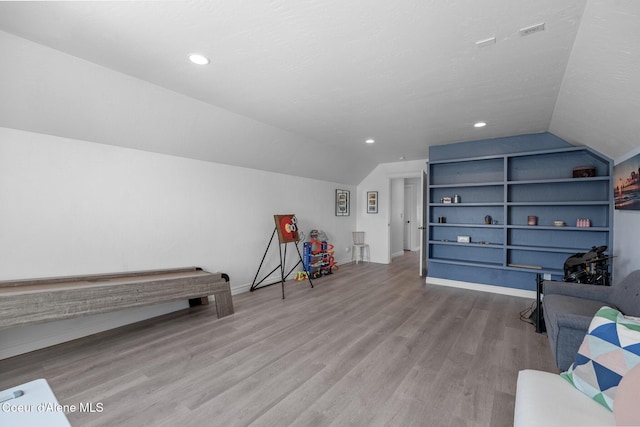 9433 N Justice Way, Hayden, ID 83835 - recreation room with lofted ceiling, wood finished floors, built in features, and recessed lighting