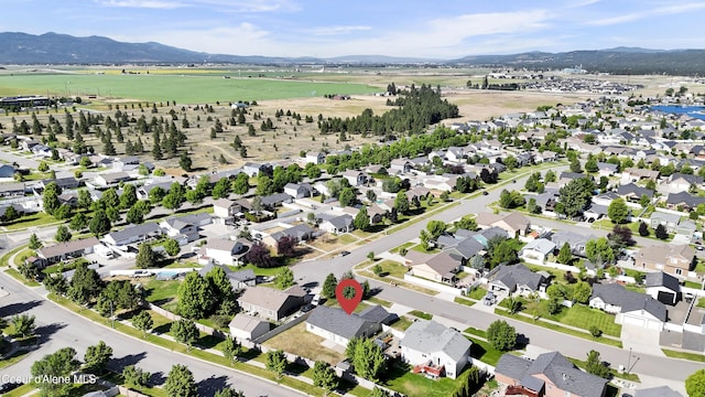 13388 N Polaris St, Rathdrum, ID 83858 - aerial view of property's location featuring a mountain backdrop and rural landscape