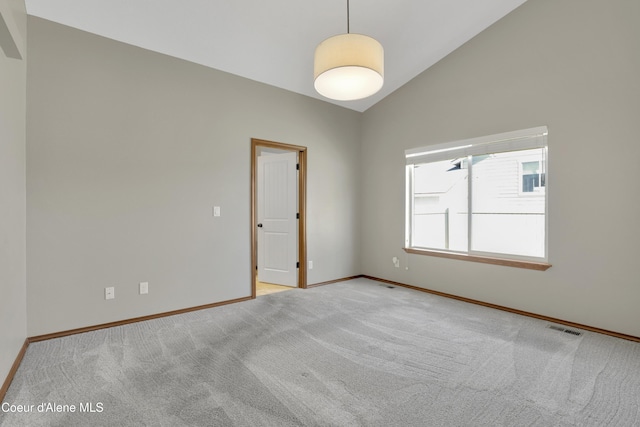 13388 N Polaris St, Rathdrum, ID 83858 - empty room featuring light carpet and high vaulted ceiling