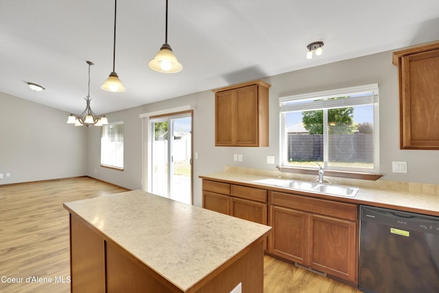 13388 N Polaris St, Rathdrum, ID 83858 - kitchen with dishwasher, a chandelier, light wood-style floors, light countertops, and a center island