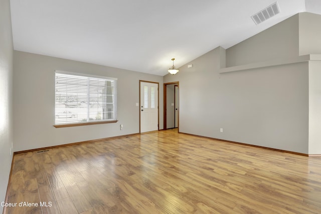 13388 N Polaris St, Rathdrum, ID 83858 - empty room featuring lofted ceiling and light wood-style flooring