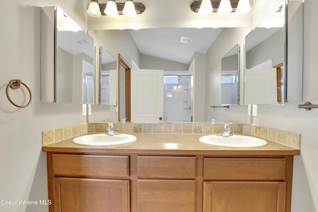 13388 N Polaris St, Rathdrum, ID 83858 - bathroom with double vanity, vaulted ceiling, and a shower with shower door