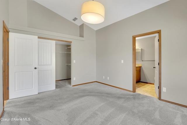 13388 N Polaris St, Rathdrum, ID 83858 - unfurnished bedroom featuring light carpet, a closet, ensuite bath, and high vaulted ceiling