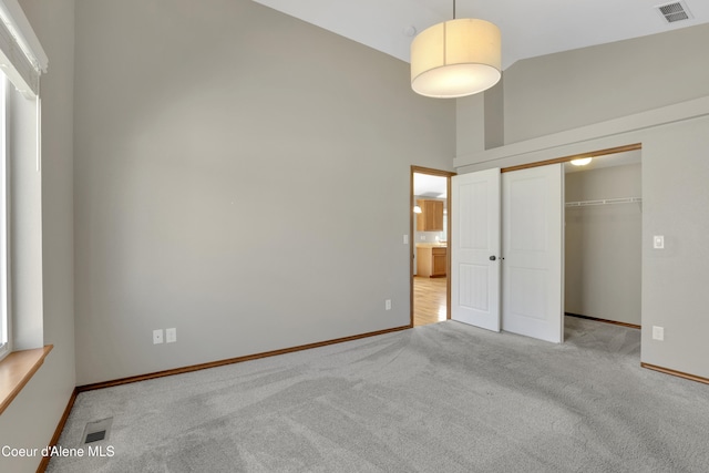 13388 N Polaris St, Rathdrum, ID 83858 - unfurnished bedroom with high vaulted ceiling, carpet flooring, and a closet