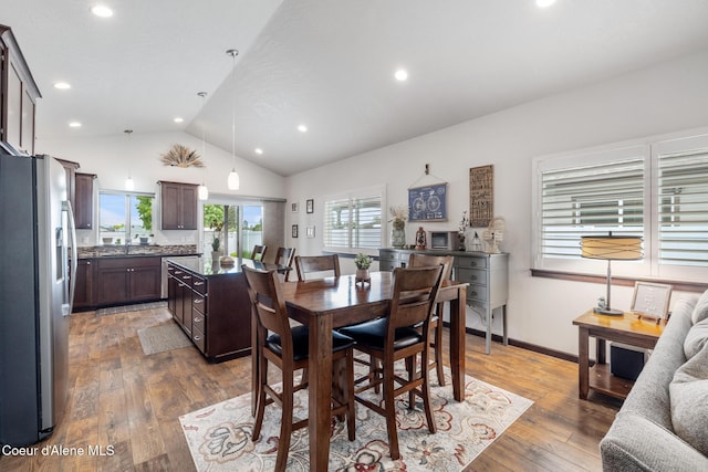 10939 N Seaside St, Hayden, ID 83835 - dining room featuring vaulted ceiling, hardwood / wood-style floors, and recessed lighting