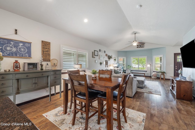 10939 N Seaside St, Hayden, ID 83835 - dining room with a ceiling fan, vaulted ceiling, dark wood-style floors, and recessed lighting
