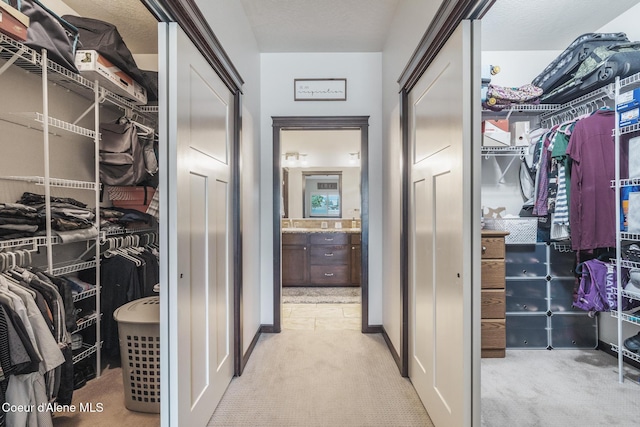 10939 N Seaside St, Hayden, ID 83835 - walk in closet featuring light colored carpet