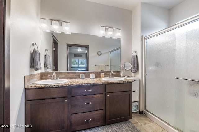 10939 N Seaside St, Hayden, ID 83835 - bathroom featuring a shower stall, tile patterned floors, and double vanity