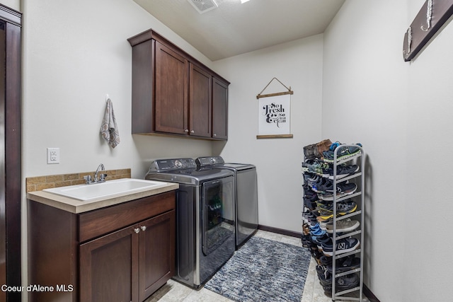 10939 N Seaside St, Hayden, ID 83835 - laundry area featuring washer and clothes dryer and cabinet space