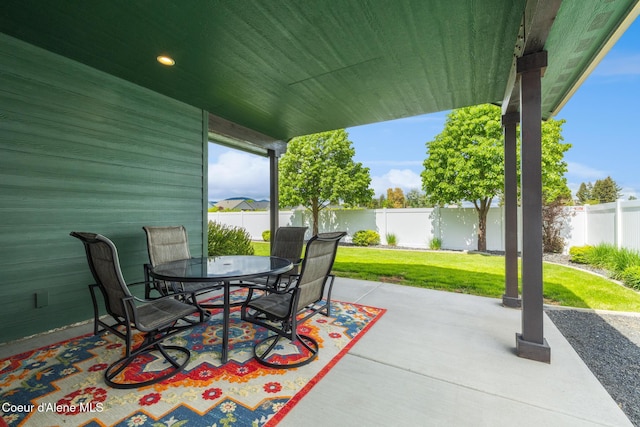 10939 N Seaside St, Hayden, ID 83835 - fenced backyard featuring a patio and outdoor dining space
