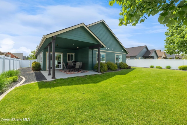10939 N Seaside St, Hayden, ID 83835 - back of property with a patio area and a fenced backyard