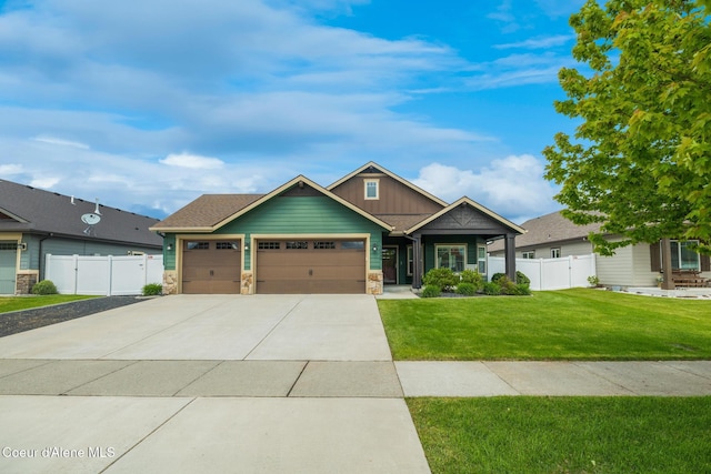 10939 N Seaside St, Hayden, ID 83835 - craftsman house featuring an attached garage, stone siding, driveway, and board and batten siding