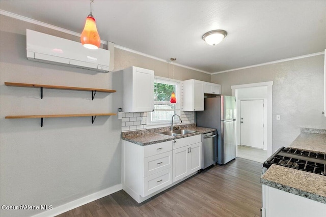 1613 E Coeur D Alene Ave, Coeur Dalene, ID 83814 - kitchen with stainless steel appliances, an AC wall unit, dark wood-style flooring, white cabinets, and decorative backsplash
