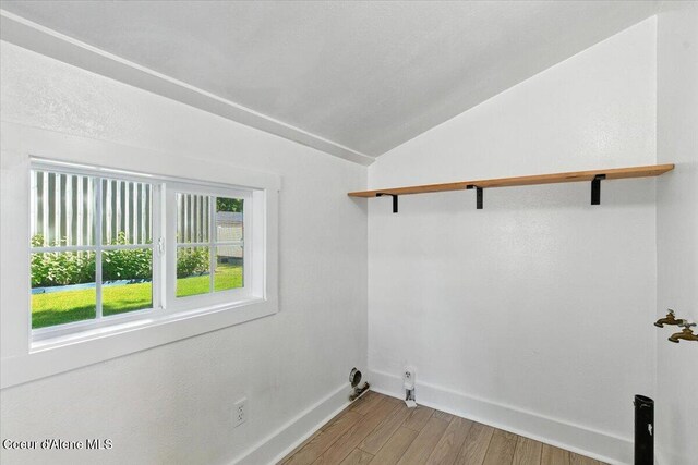 1613 E Coeur D Alene Ave, Coeur Dalene, ID 83814 - laundry area with baseboards and wood finished floors