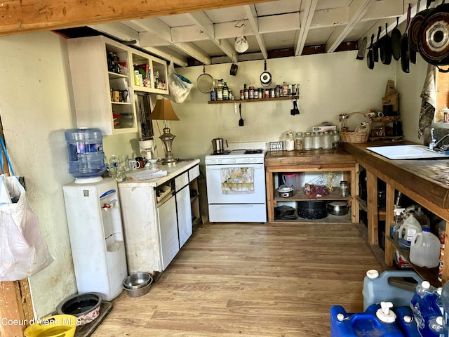 1484 W Elkhorn Meadows Rd, Fernwood, ID 83830 - kitchen featuring white range with gas cooktop, open shelves, light wood finished floors, and light countertops