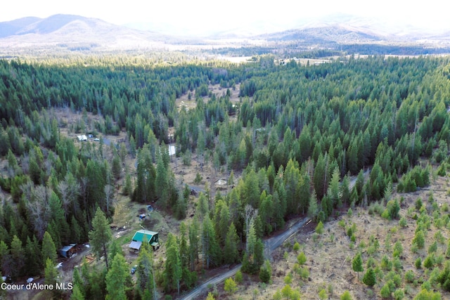 1484 W Elkhorn Meadows Rd, Fernwood, ID 83830 - view of property location featuring a forest and a mountain backdrop