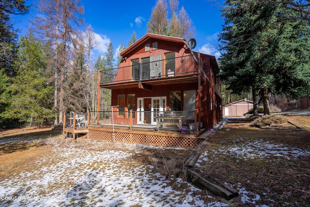 5341 Hoo Doo Loop, Oldtown, ID 83822 - snow covered rear of property featuring a balcony, a deck, and french doors