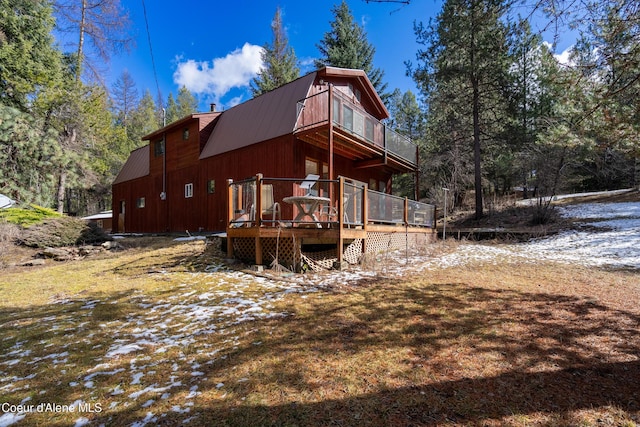 5341 Hoo Doo Loop, Oldtown, ID 83822 - rear view of property featuring a deck, a metal roof, a balcony, a chimney, and a gambrel roof