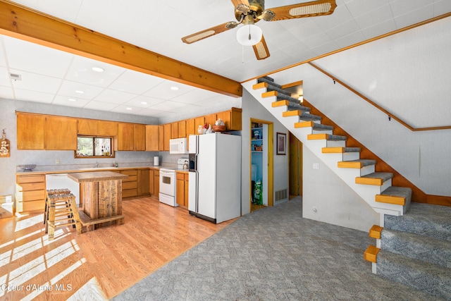5341 Hoo Doo Loop, Oldtown, ID 83822 - kitchen with white appliances, brown cabinets, light countertops, recessed lighting, and ceiling fan