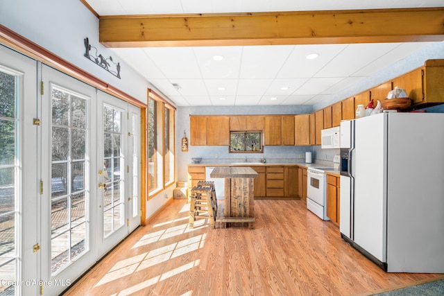 5341 Hoo Doo Loop, Oldtown, ID 83822 - kitchen featuring white appliances, healthy amount of natural light, light wood finished floors, light countertops, and recessed lighting
