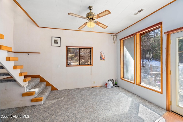 5341 Hoo Doo Loop, Oldtown, ID 83822 - unfurnished living room with crown molding, ceiling fan, carpet floors, and stairway