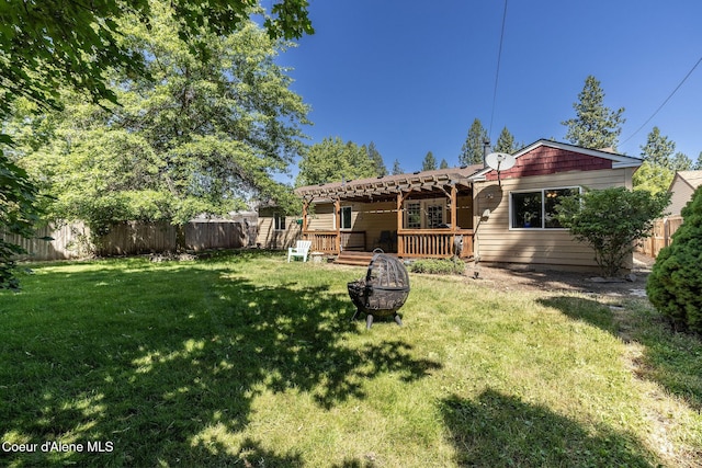 1814 E Jenny Lynn Ln, Coeur Dalene, ID 83815 - back of house with an outdoor fire pit, a deck, a fenced backyard, and a pergola