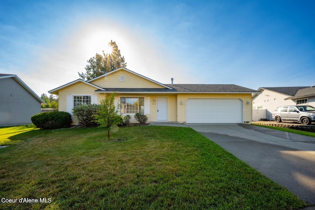 2640 N Wickiup Dr, Post Falls, ID 83854 - single story home featuring an attached garage, concrete driveway, and a front lawn