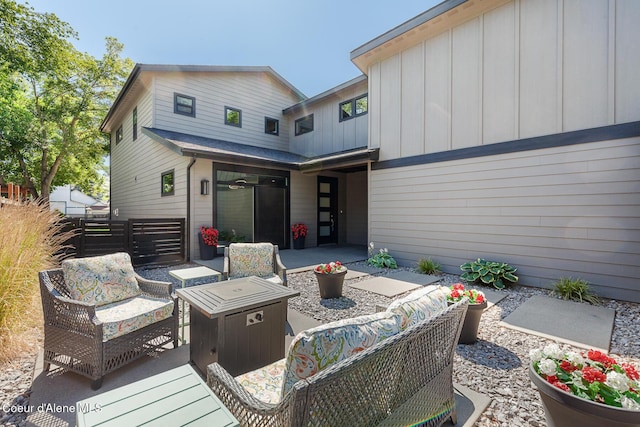 838 N Government Way, Coeur Dalene, ID 83814 - back of property with an outdoor hangout area, a patio area, and board and batten siding
