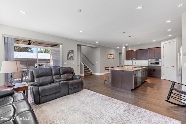 838 N Government Way, Coeur Dalene, ID 83814 - living area with recessed lighting, dark wood-style floors, and stairway